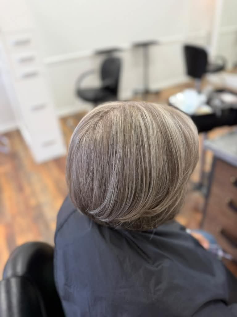 Silver-blonde highlights on a polished bob